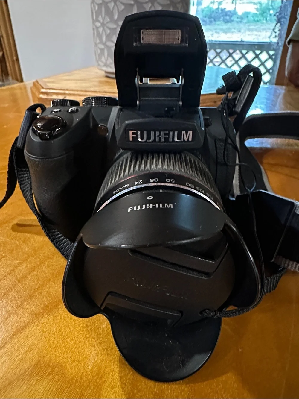 Fujifilm Black Camera Body with Black Lens and Red Trim